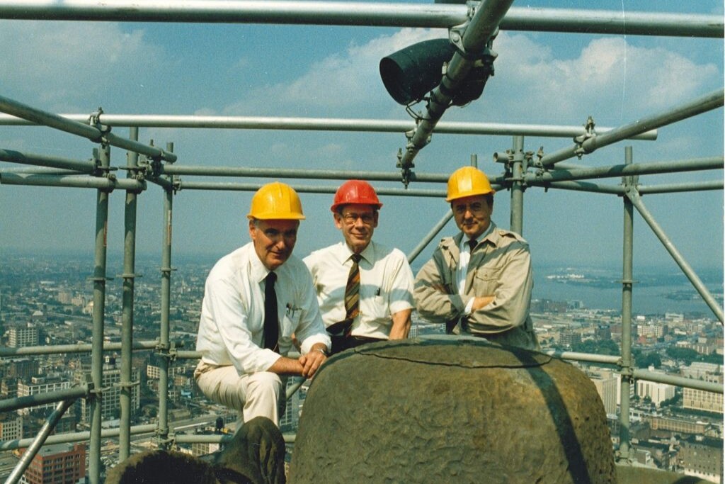 Thomas J. Leidigh, Carl A. Baumert Jr., and Nicholas L. Gianopulos of Keast & Hood atop scaffolding above Philadelphia, 1987